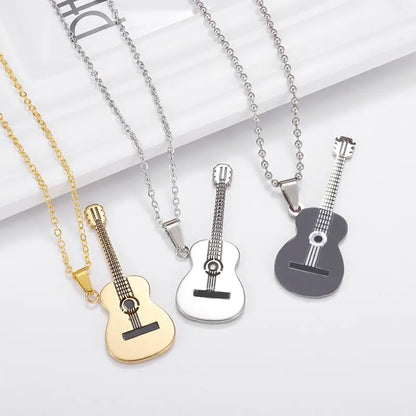 Acoustic Guitar Necklace Available in Black, Silver, or Gold near white frame | Sacred Tune