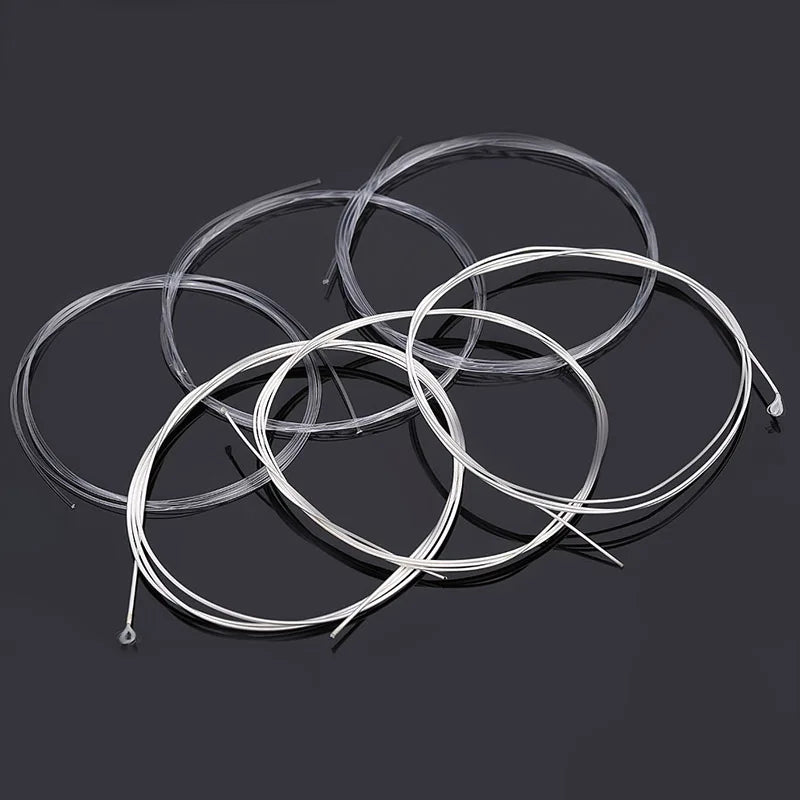 Acoustic Guitar Nylon and Silver String Set coiled set of 6 on black background perspective | Sacred Tune