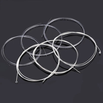 Acoustic Guitar Nylon and Silver String Set coiled set of 6 on black background perspective | Sacred Tune
