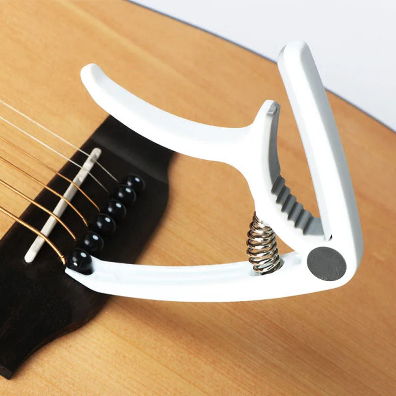 Guitar Capo in White using removal tool | Sacred Tune