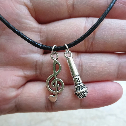 Microphone and Treble Clef Pendant Necklace in hand | Sacred Tune