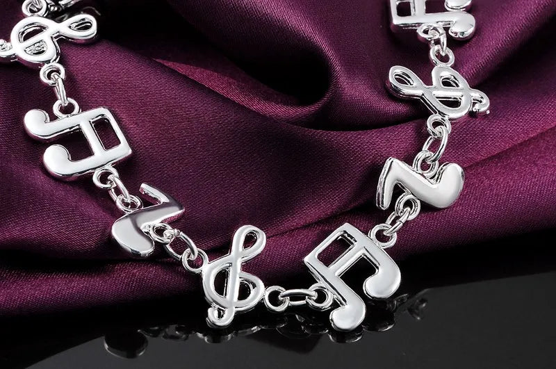 Silver Musical Bracelet - Open Bracelet on cloth background | Sacred Tune